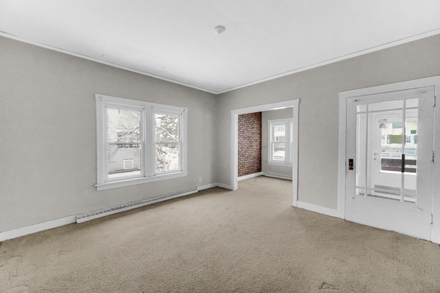 1009 Augusta Ave, Elgin, IL 60120 - spare room featuring baseboard heating, light carpet, baseboards, and crown molding