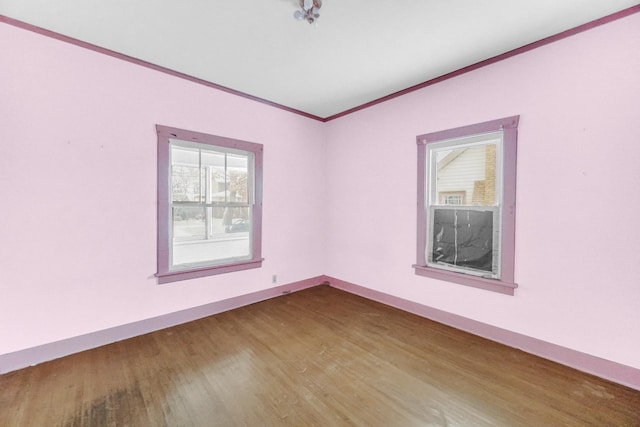 1009 Augusta Ave, Elgin, IL 60120 - empty room with crown molding, wood finished floors, and baseboards