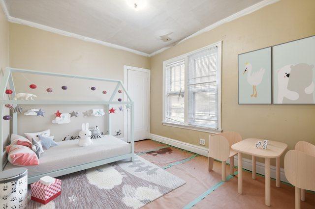 bedroom featuring ornamental molding