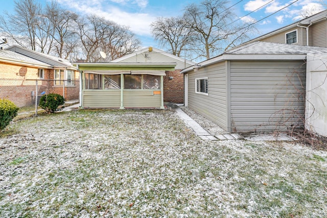 rear view of house with a sunroom