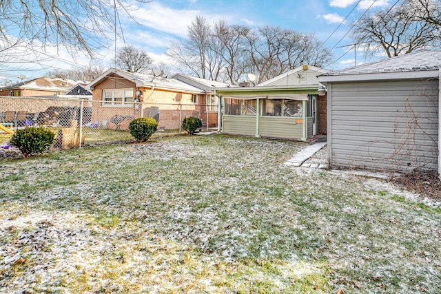 view of yard with a sunroom