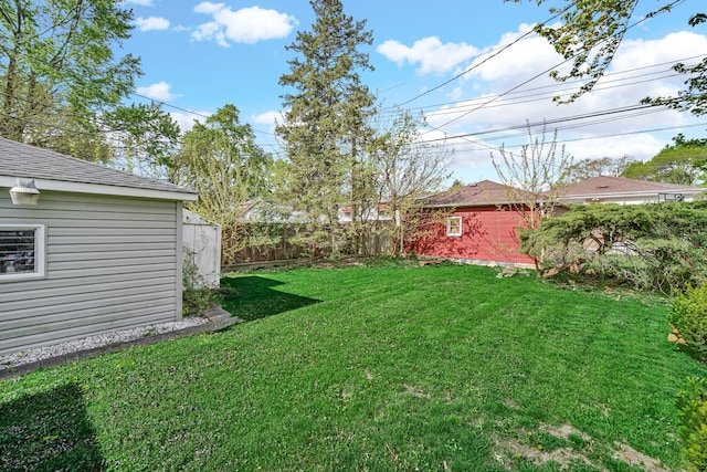 view of yard with an outbuilding and a shed