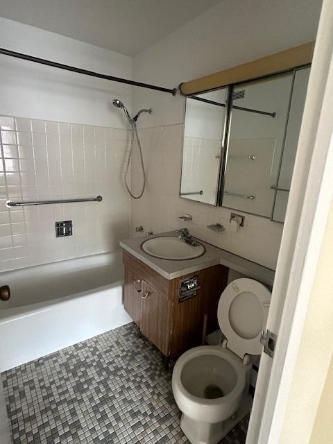 full bathroom with tile patterned flooring, vanity, toilet, and shower / tub combination