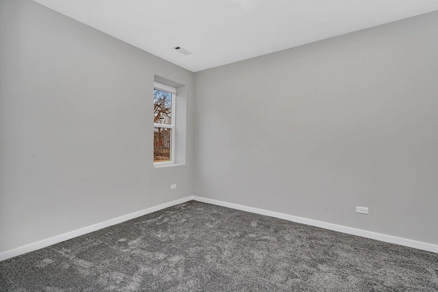 unfurnished room featuring carpet flooring