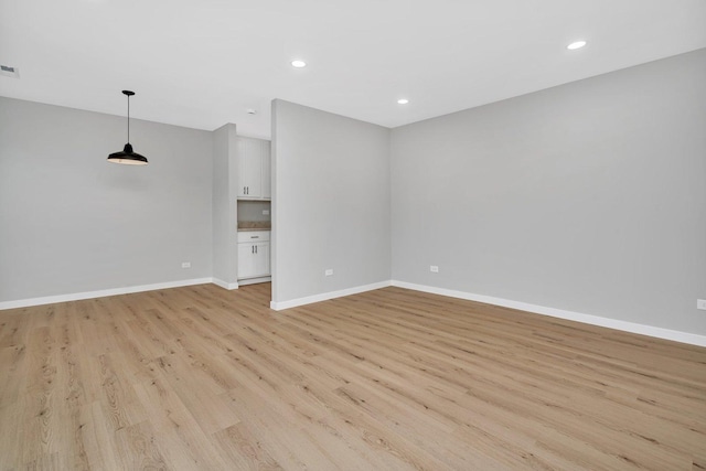 unfurnished living room with light wood-type flooring