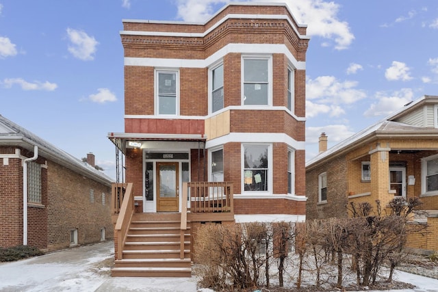 view of front of house featuring brick siding