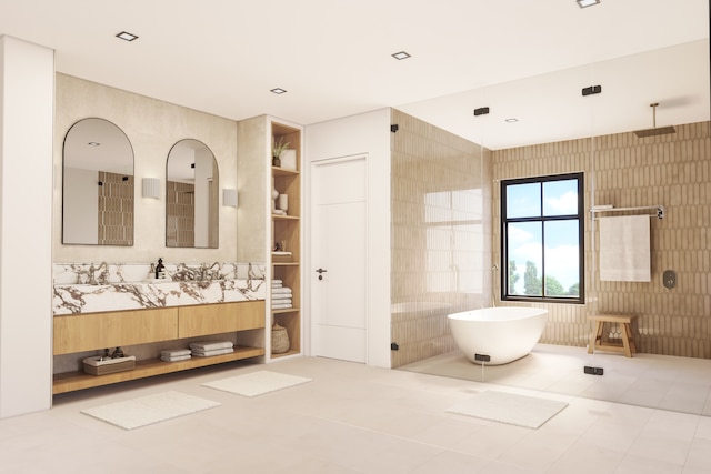 bathroom featuring a washtub, built in features, tile patterned flooring, tile walls, and vanity