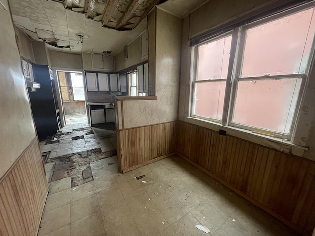 interior space featuring wood walls