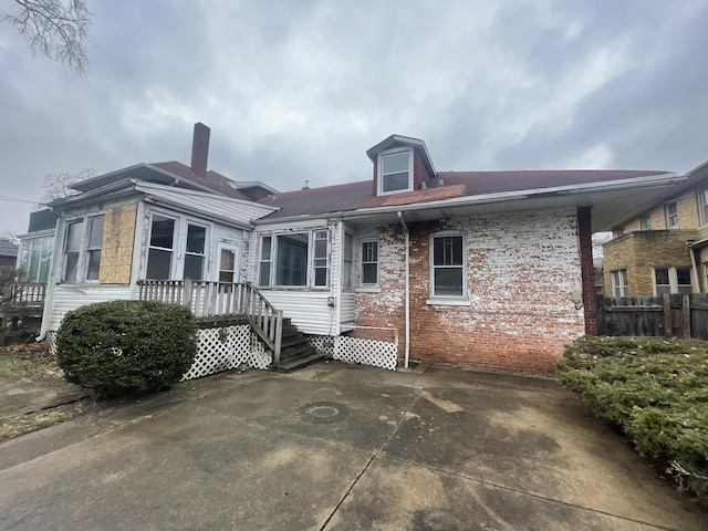 rear view of property with a patio area