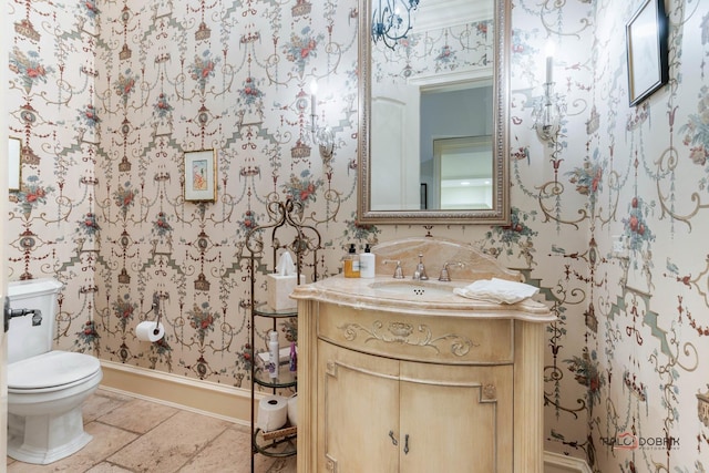 bathroom featuring vanity and toilet