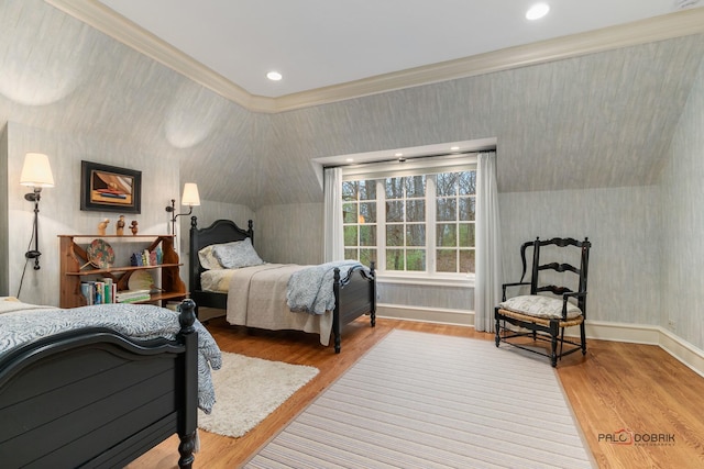 bedroom with ornamental molding and wood-type flooring