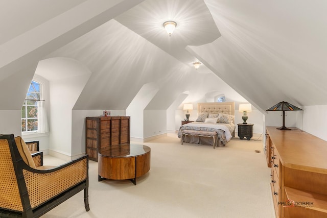 bedroom featuring carpet floors and vaulted ceiling