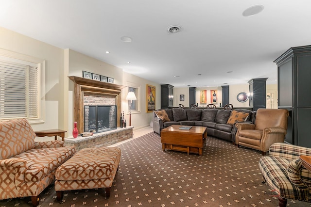 carpeted living room featuring a fireplace