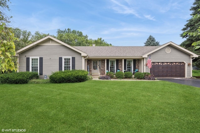 single story home with a garage and a front yard