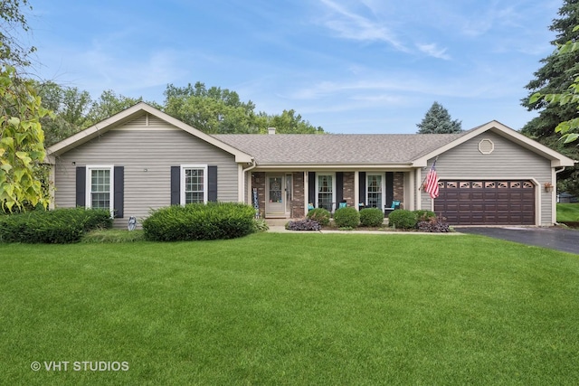 single story home featuring a front yard and a garage