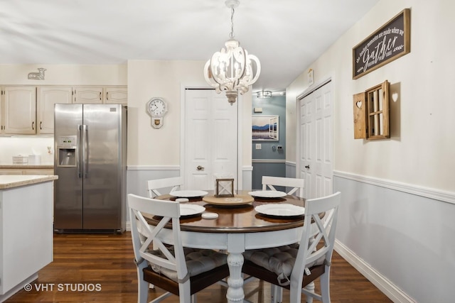 dining room featuring a chandelier and dark hardwood / wood-style flooring