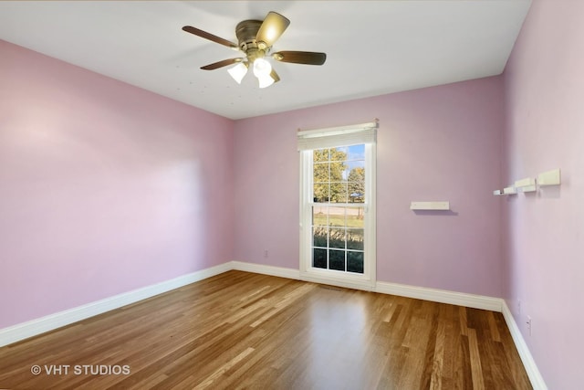 unfurnished room featuring ceiling fan and hardwood / wood-style floors