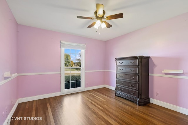 unfurnished bedroom with ceiling fan and wood-type flooring