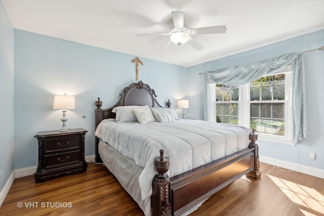 bedroom with ceiling fan and dark wood-type flooring