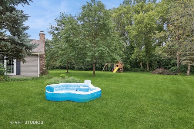 view of yard with a playground