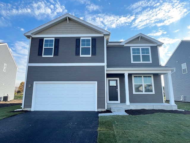 view of front of property featuring central AC, a porch, a garage, and a front lawn