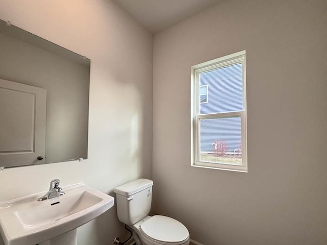 bathroom with toilet and sink