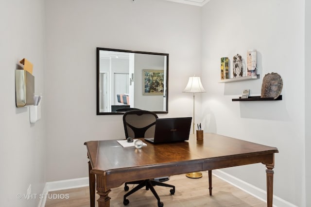 office with wood finished floors and baseboards