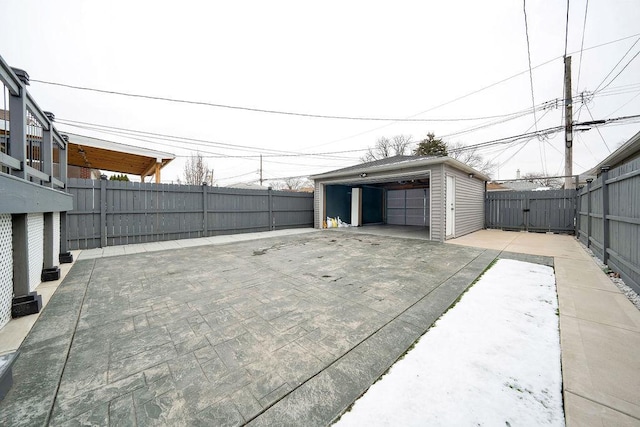 view of patio with an outdoor structure and a garage