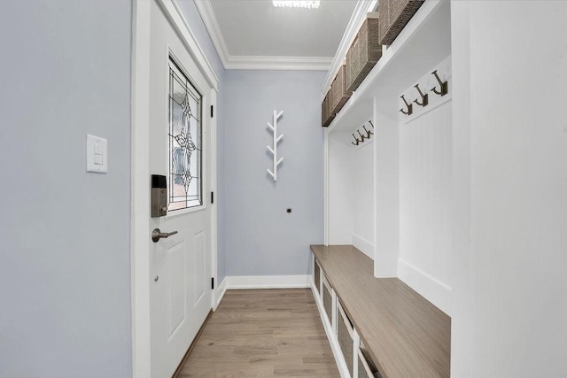 mudroom featuring light hardwood / wood-style floors and crown molding