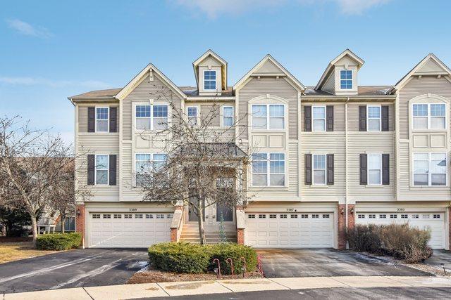 townhome / multi-family property featuring a garage