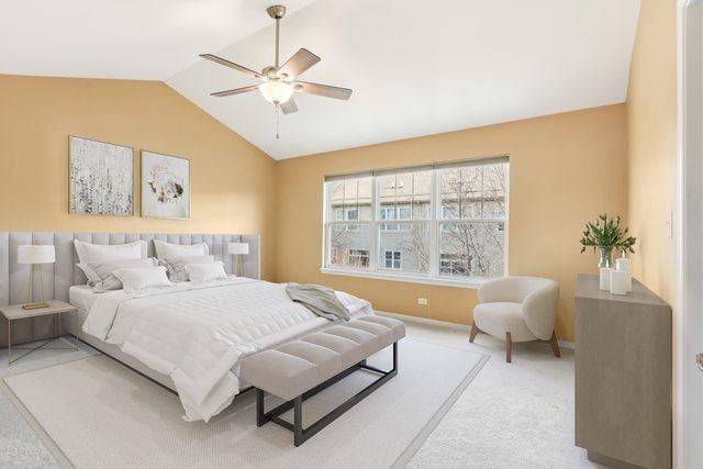 carpeted bedroom featuring lofted ceiling and ceiling fan