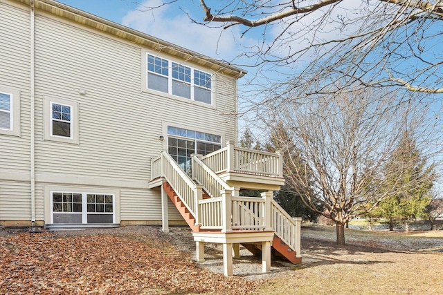 back of property featuring a wooden deck