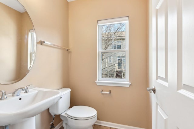 bathroom with toilet and sink