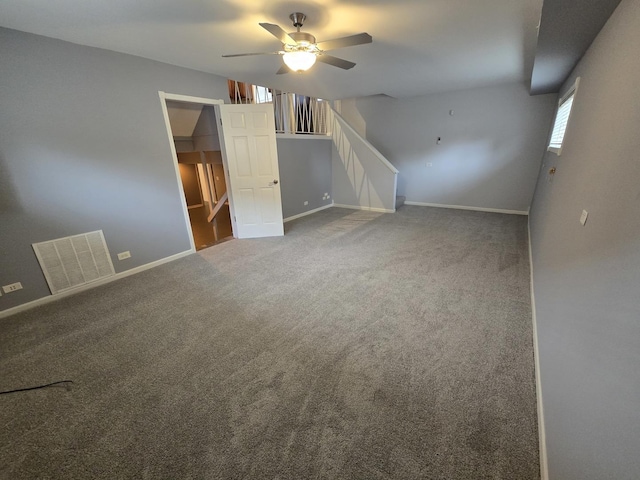 spare room with carpet and ceiling fan