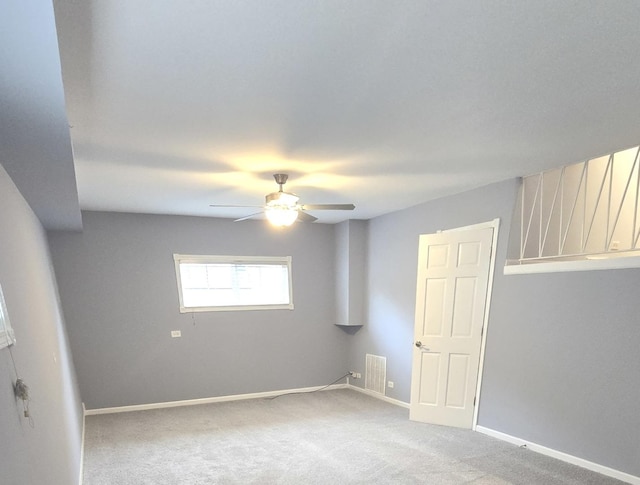 carpeted empty room with ceiling fan