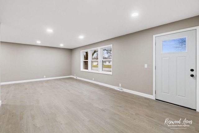 foyer with light wood-type flooring