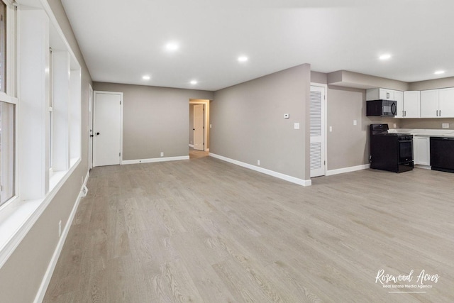 unfurnished living room with light hardwood / wood-style floors