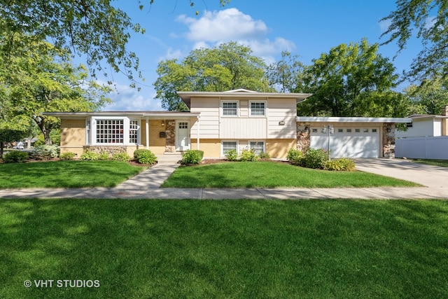 split level home featuring a front yard and a garage