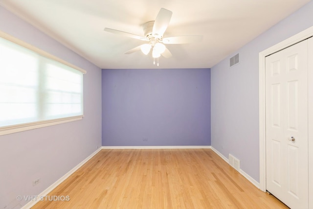 spare room with ceiling fan and light hardwood / wood-style floors