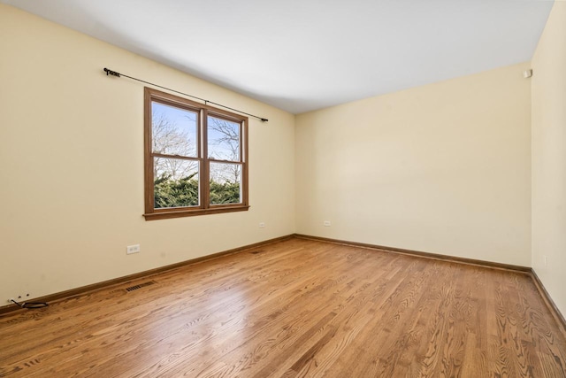 unfurnished room featuring light wood-type flooring