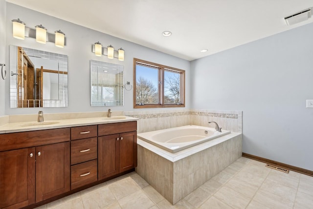 bathroom with tile patterned flooring, vanity, and separate shower and tub