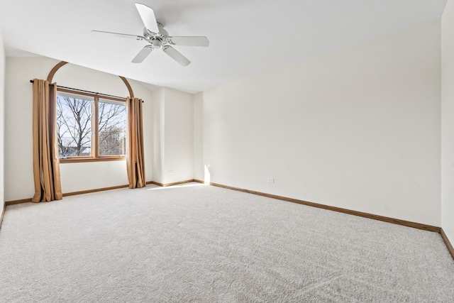 unfurnished room with light colored carpet and ceiling fan