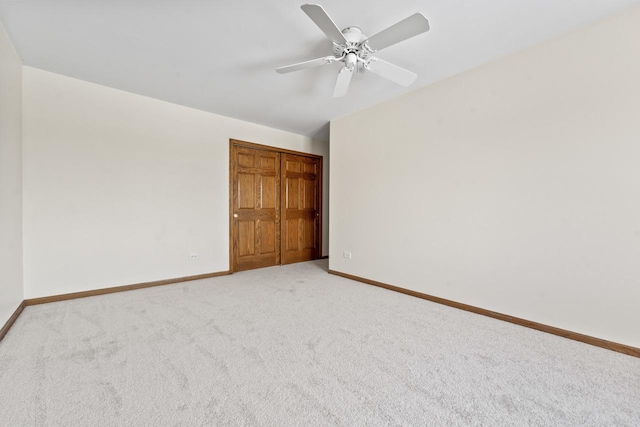 unfurnished bedroom featuring ceiling fan and carpet flooring