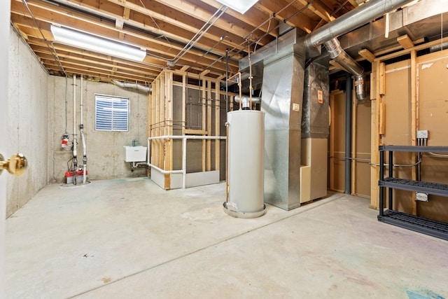 basement featuring water heater, sink, and heating unit