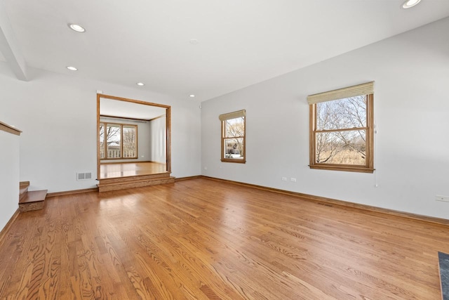 unfurnished living room featuring light hardwood / wood-style flooring