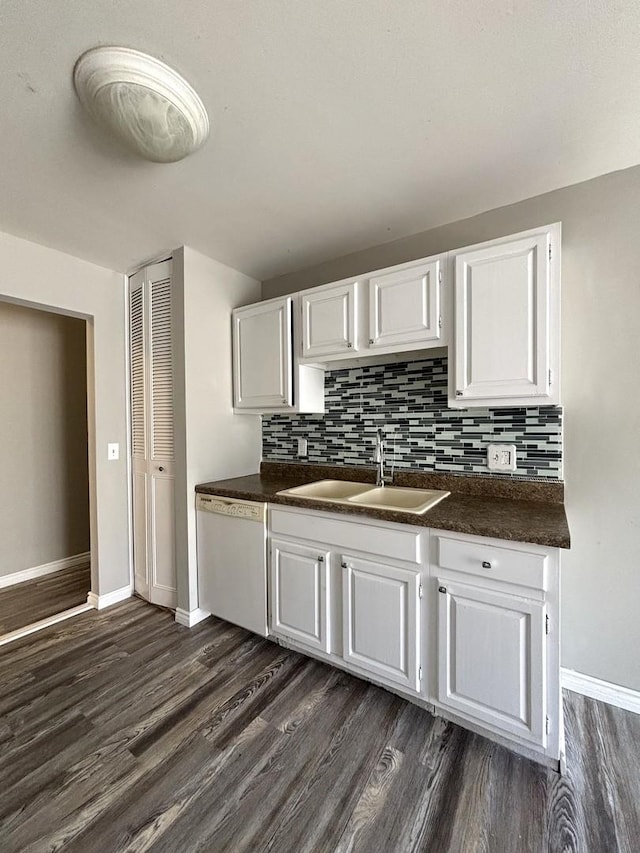 kitchen featuring white dishwasher, dark hardwood / wood-style floors, white cabinets, and sink