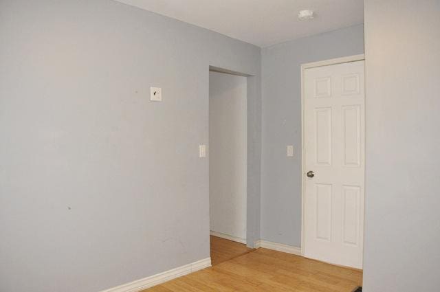 spare room with light hardwood / wood-style floors