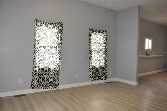 spare room featuring hardwood / wood-style flooring