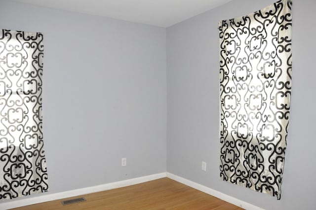 spare room featuring hardwood / wood-style flooring