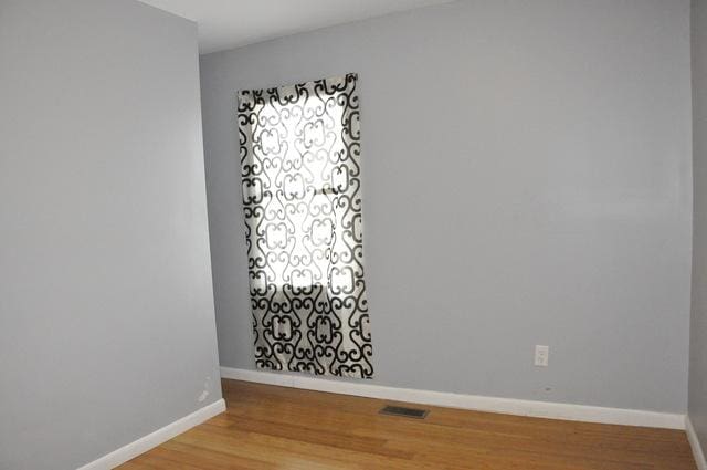 spare room featuring hardwood / wood-style flooring